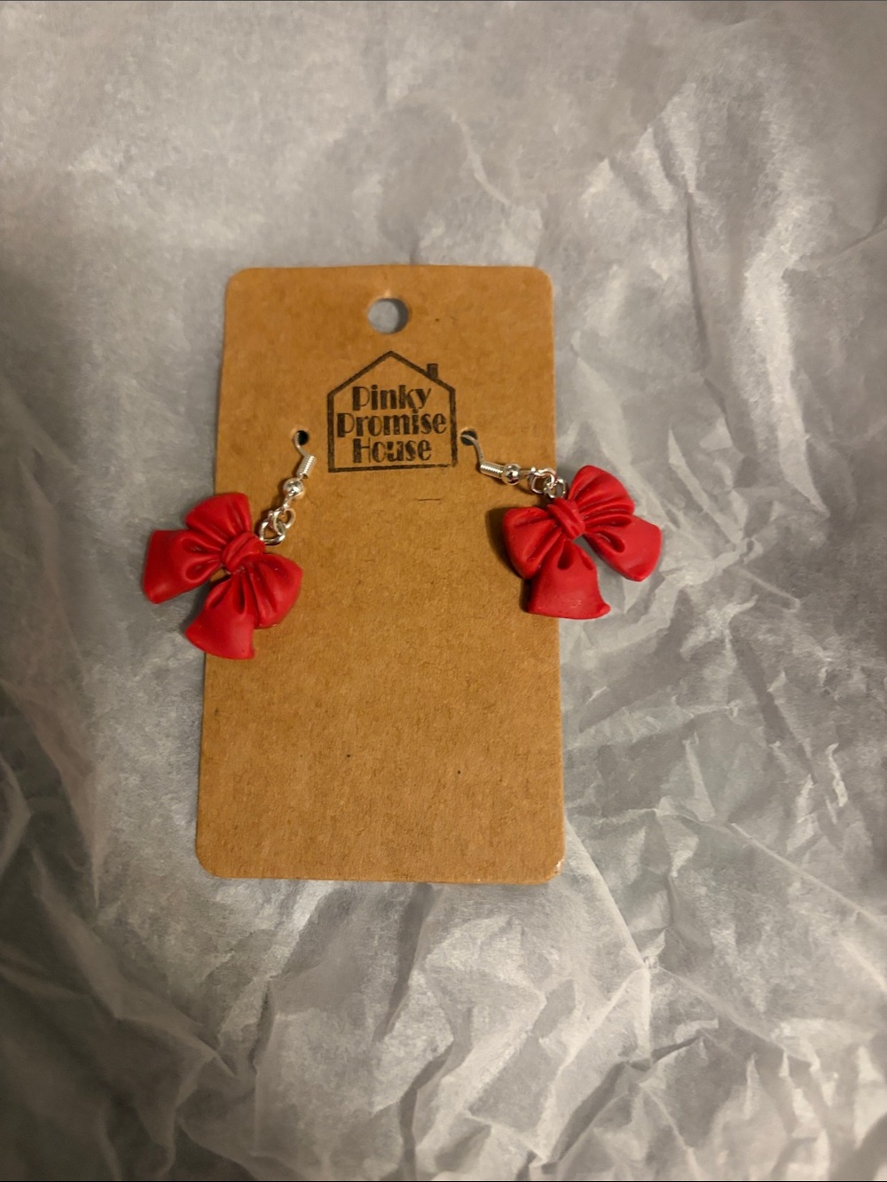 Red Bow Dangle pierced Earrings from a small boutique store. Handmade.